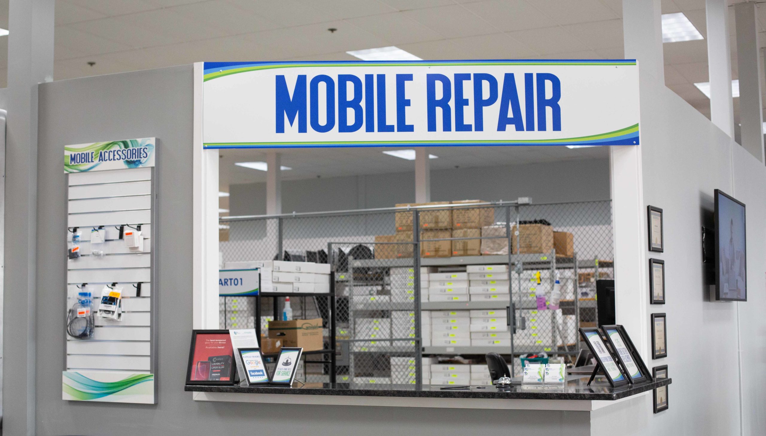 Technician repairing a mobile phone